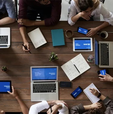 a group of people discussing product strategy during a meeting